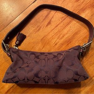 Coach small handbag. Like new. Only used a few times. Purple/burgundy color.